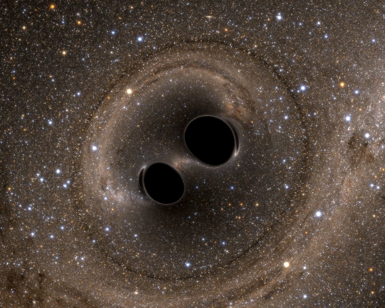 Une simulation informatique de la collision de deux trous noirs publiée après l'événement a été détectée pour la première fois par Ligo en 2016 - ©Laboratoire LIGO/Reuters