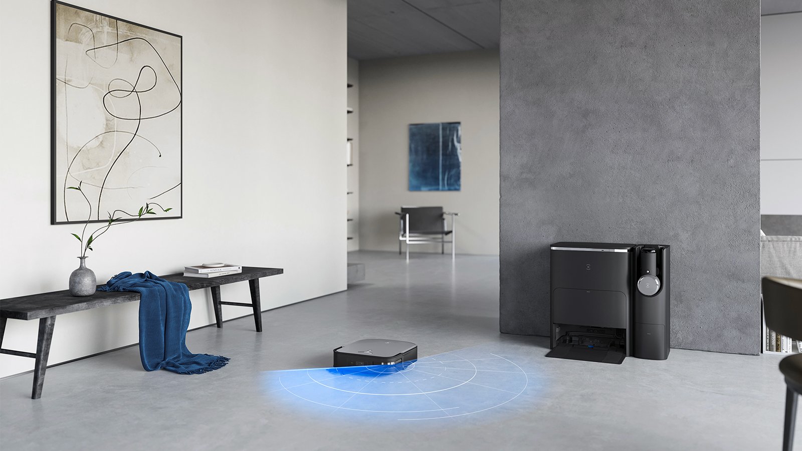 Un aspirateur robot et un aspirateur balai