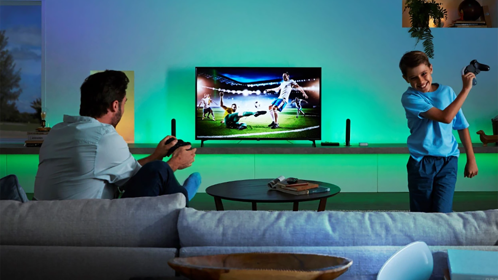 Le boîtier de synchronisation Philips Hue Play et deux lampes Philips Hue