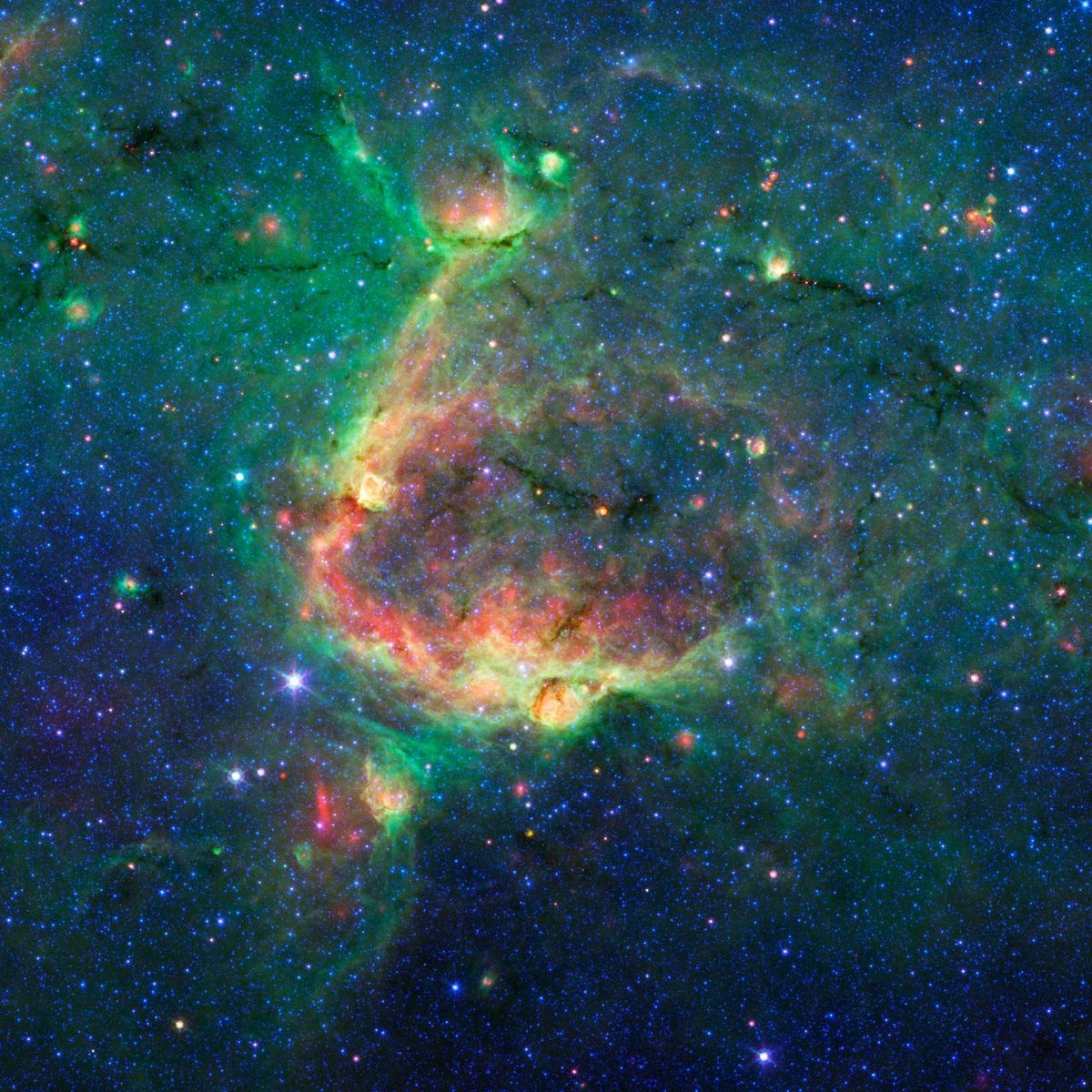 Vus en infrarouge, des "bulles" de gaz s'étendent vers l'infini. Crédits NASA/JPL-Caltech/University of Wisconsin