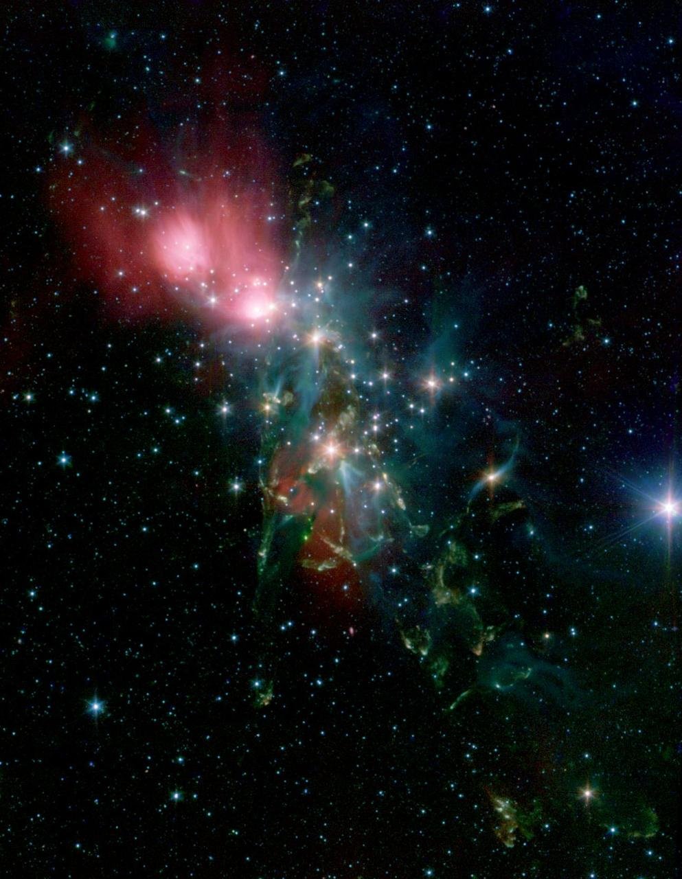 Une "nurserie d'étoiles" au milieu d'une nébuleuse gazeuse de la constellation Perseus. Crédits NASA/JPL-Caltech/Harvard-Smithsonian CfA