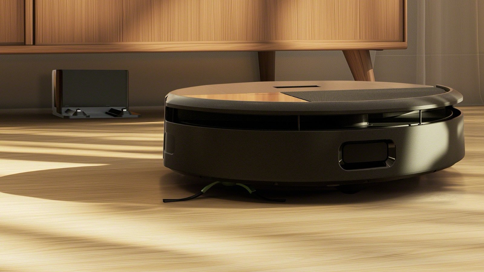 Un des rares avantages des bases simples : on peut les placer discrètement sous un meuble ! © iRobot