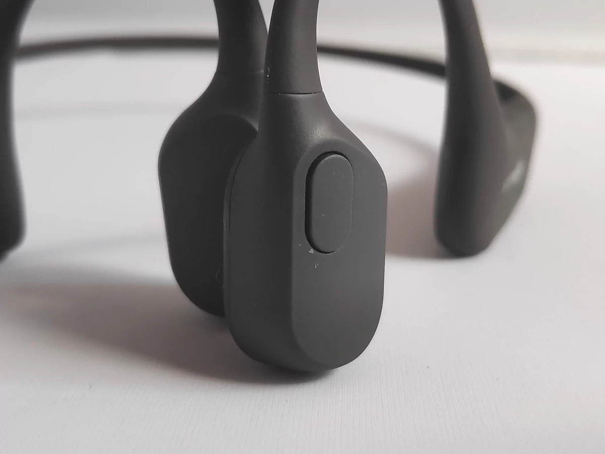 Aftershokz Aeropex - Bouton gauche