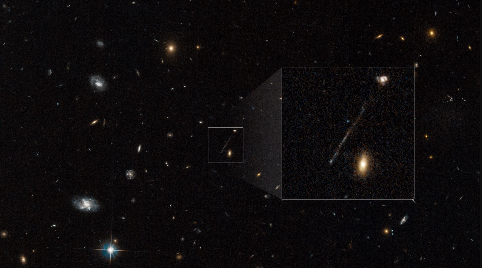 Cette trace sur une photo d'Hubble... C'est un trou noir suivi par des milliers d'étoiles !