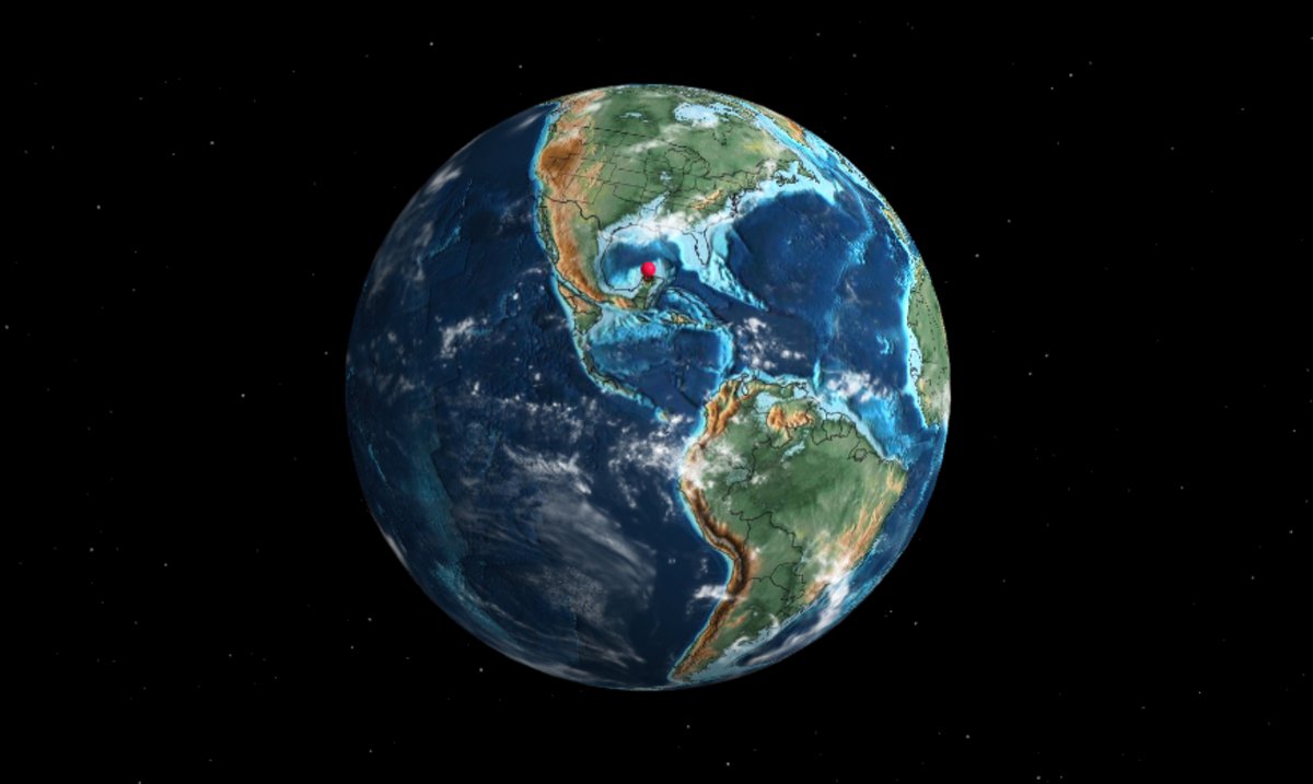 La Terre au moment de l'extinction des dinosaures, le point rouge indique où s'est écrasé l'astéroïde en cause dans cette extinction de masse. © Ancient Earth Globe